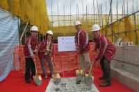 Members of the Hostel, Building and Campus Management Committee participating in the topping-out ceremony